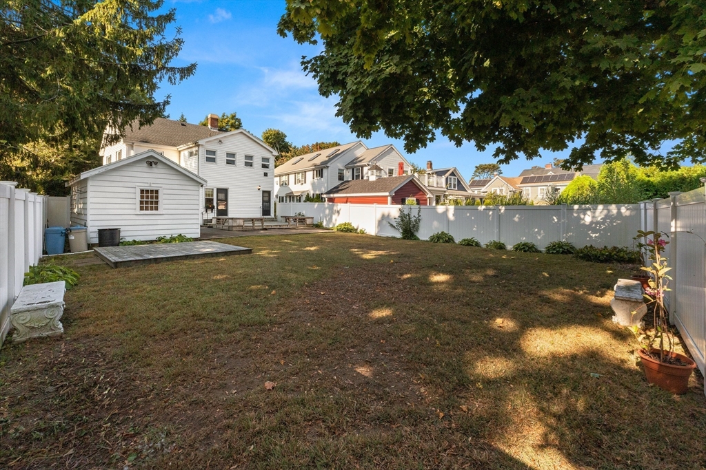 25 High Street Beverly, MA 01915 - Photo 40 of 42 a view of a house with a yard