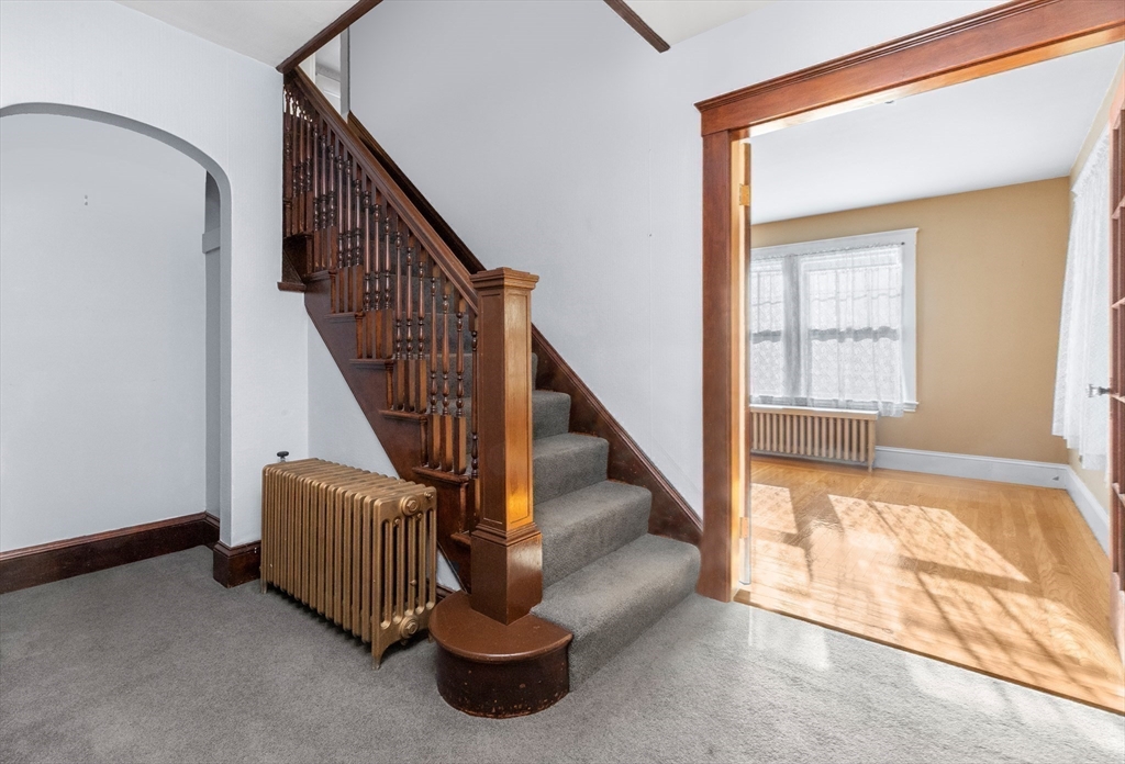 25 High Street Beverly, MA 01915 - Photo 4 of 42 a view of entryway and hall with wooden floor