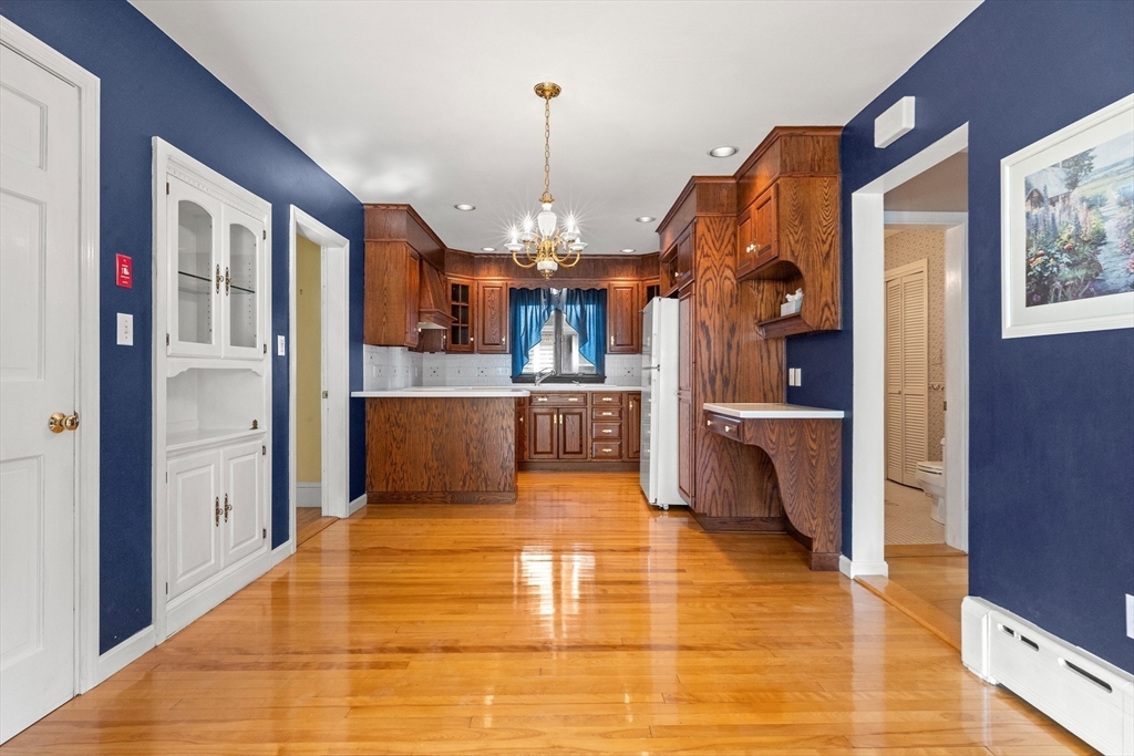 25 High Street Beverly, MA 01915 - Photo 9 of 42 a view of a living room and kitchen with windows