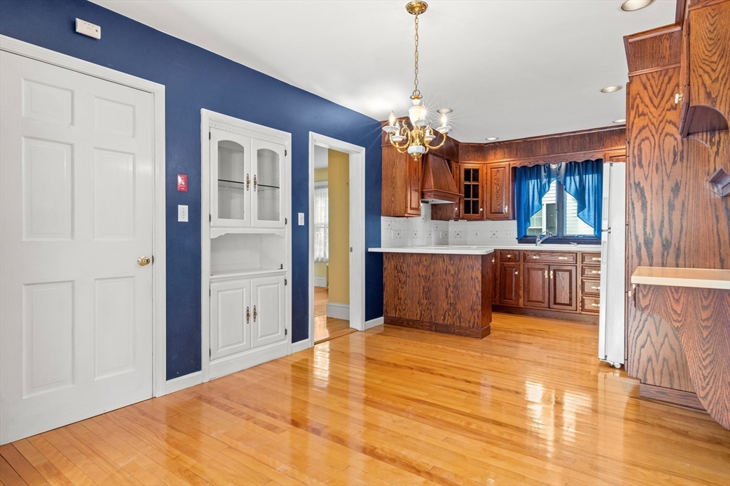 25 High Street Beverly, MA 01915 - Photo 10 of 42 a view of a living room and kitchen with furniture