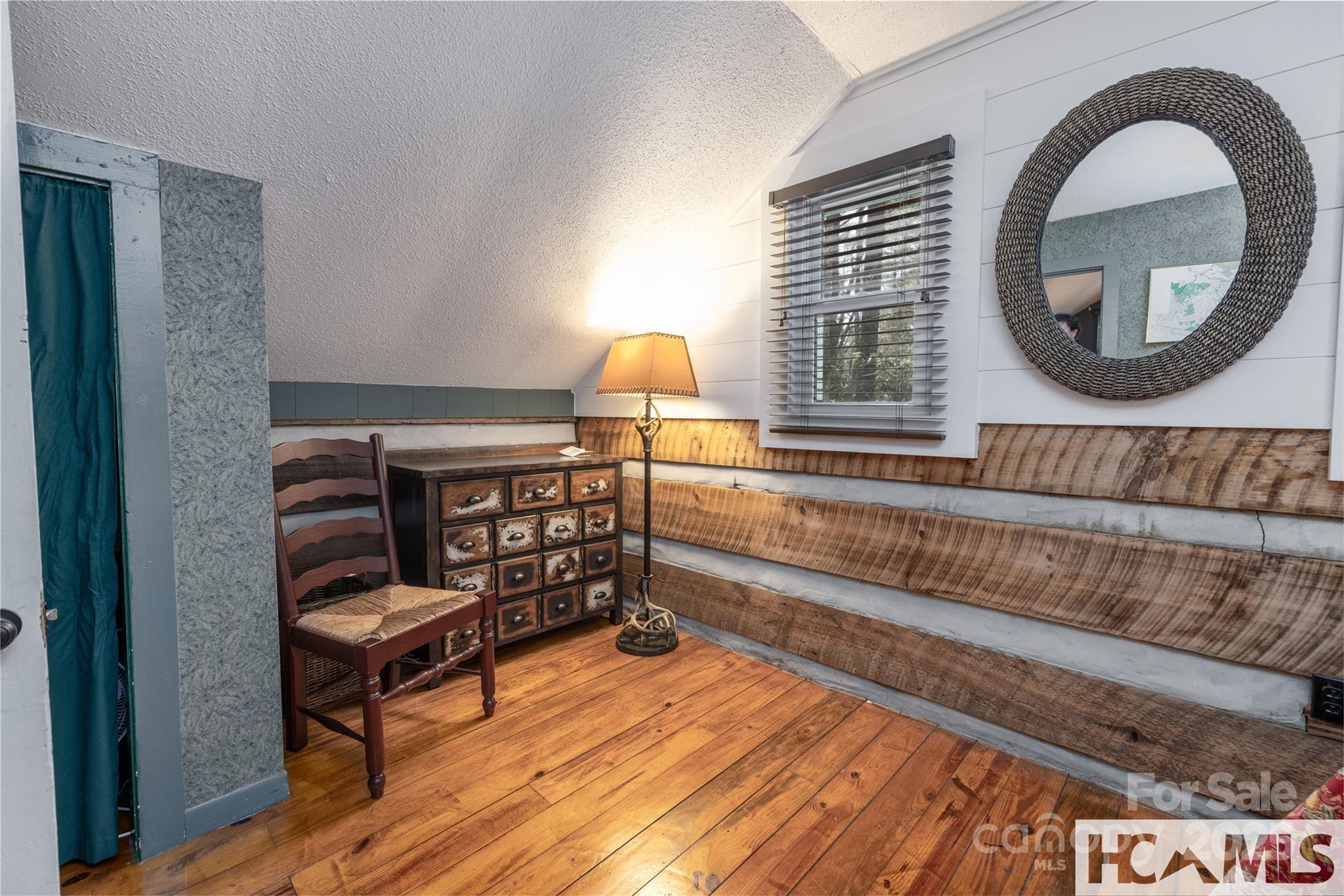 1524 McCall Road Cashiers, NC 28717 - Photo 19 of 35 a living room with furniture and a wooden floor