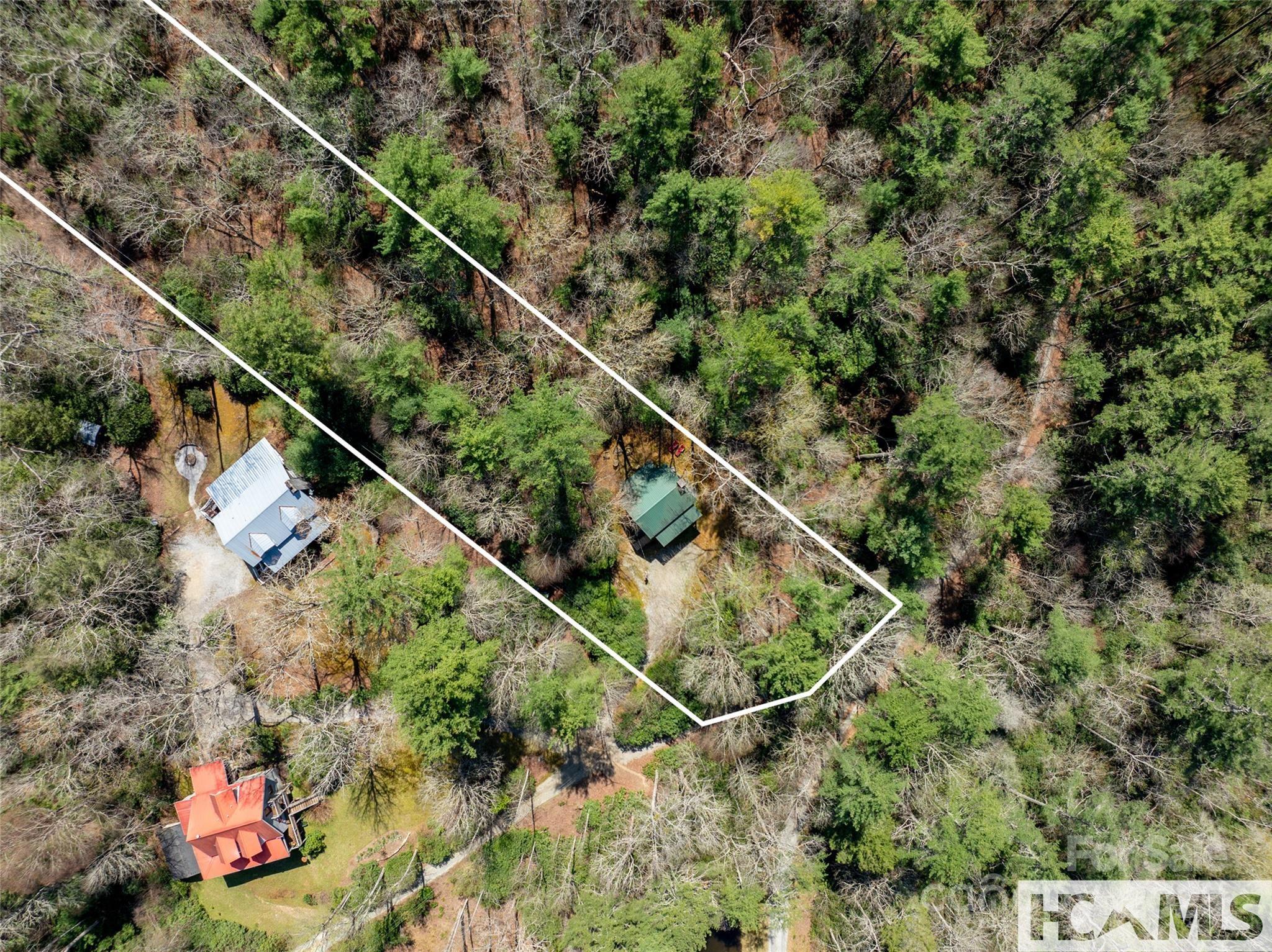 1524 McCall Road Cashiers, NC 28717 - Photo 24 of 35 a aerial view of a house with a tree