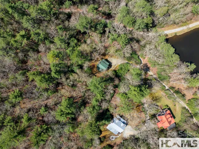 a view of a lush green hillside and a building
