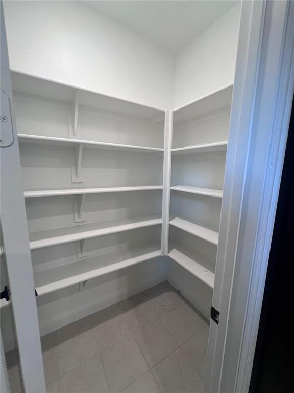 6825 Entwistle Road Frisco, TX 75034 - Photo 7 of 33 a view of walk in closet with empty racks