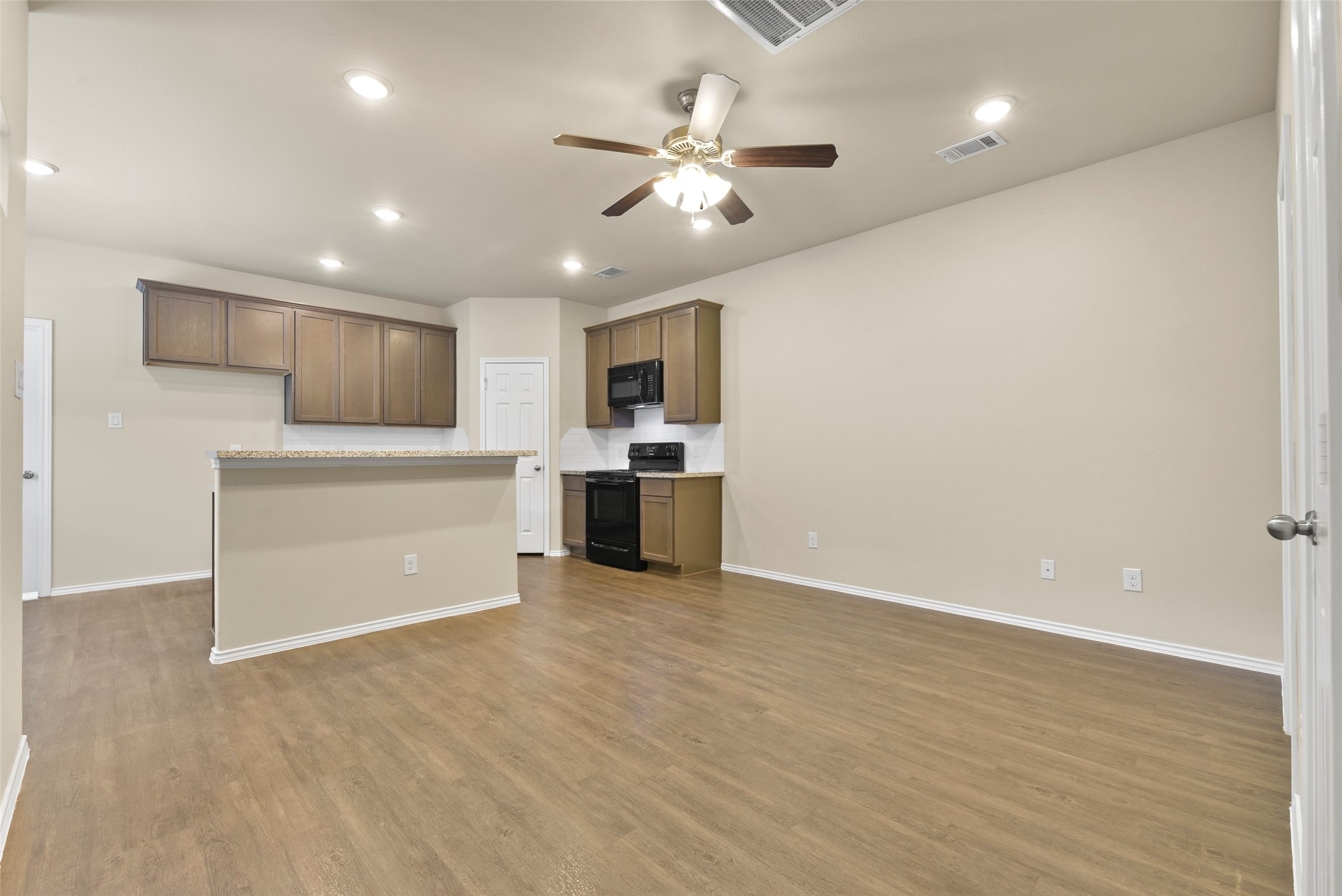 9650 Warm Spring Willis, TX 77318 - Photo 11 of 26 a view of a kitchen with a sink and cabinets
