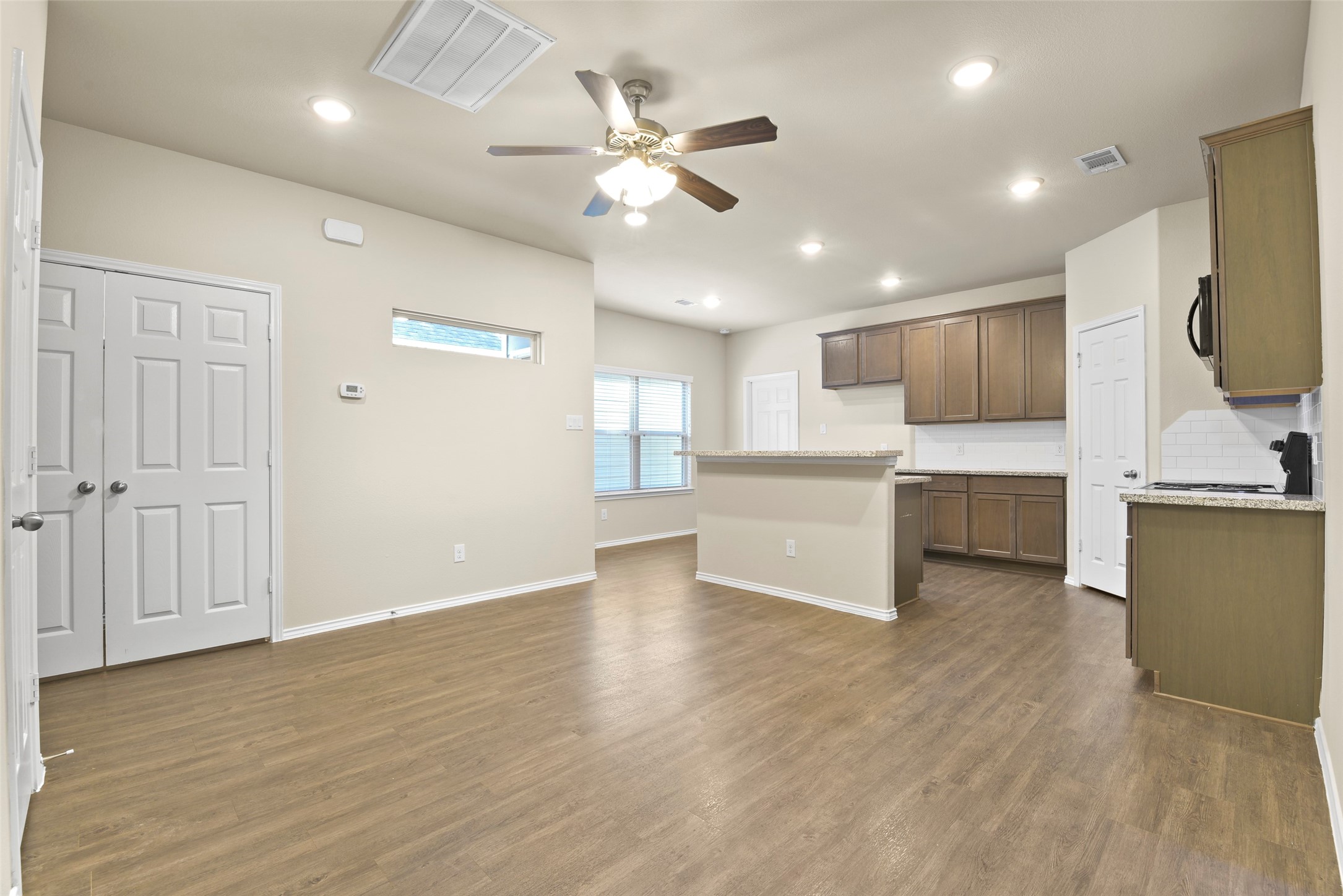 9650 Warm Spring Willis, TX 77318 - Photo 13 of 26 a view of kitchen with microwave and cabinets