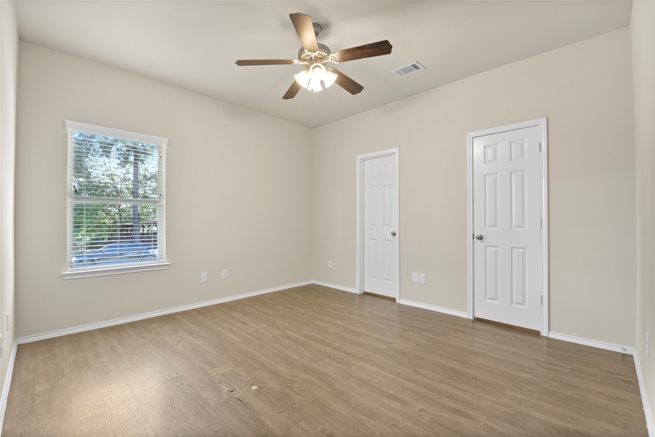 9650 Warm Spring Willis, TX 77318 - Photo 14 of 26 an empty room with fan and windows