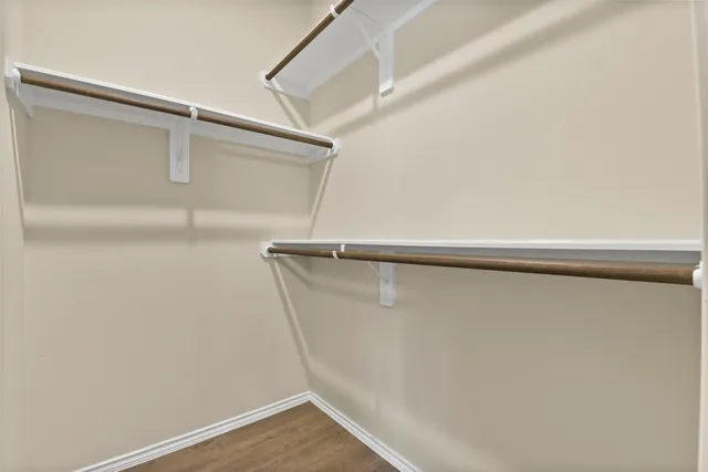 a bathroom with a granite countertop sink and shower