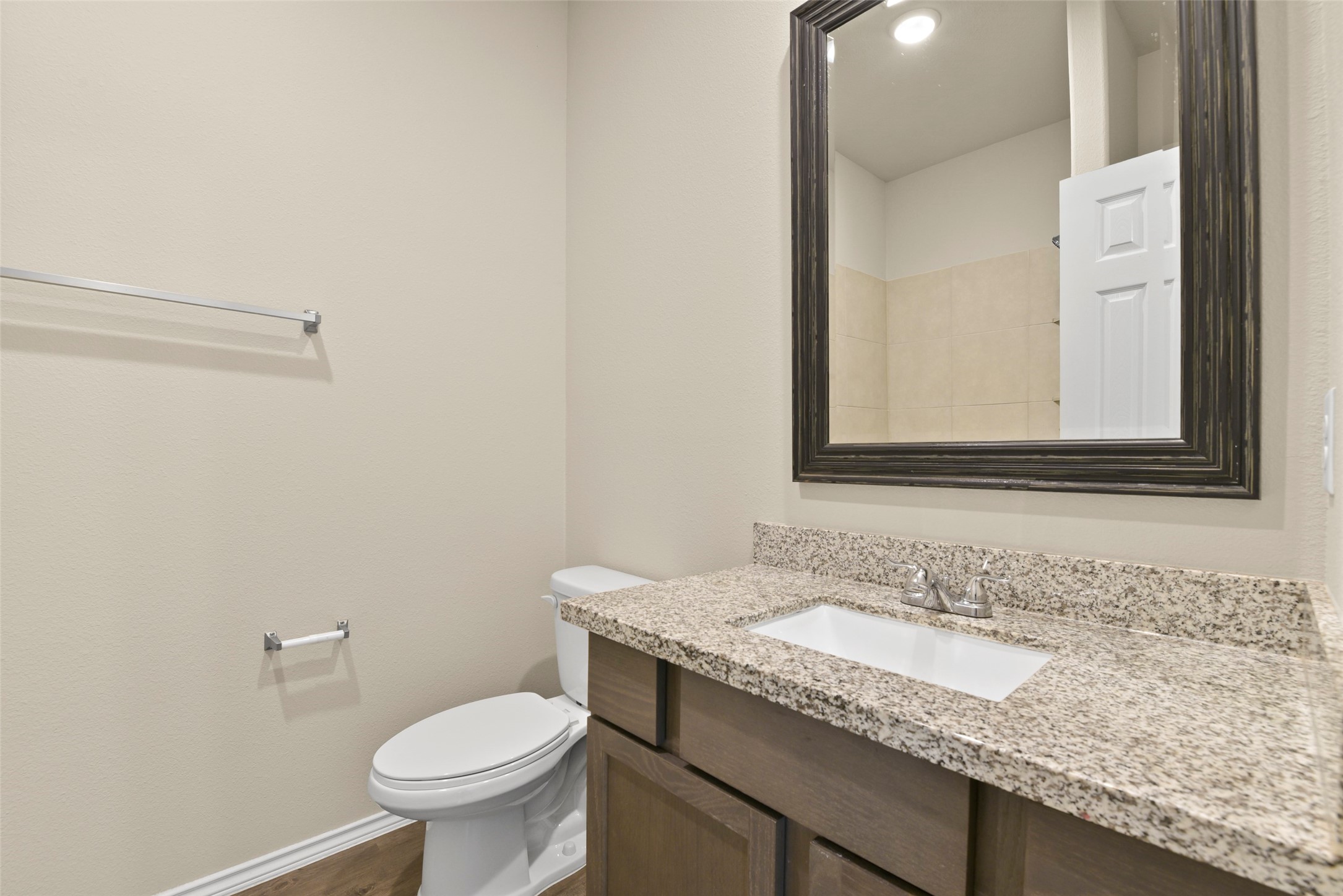 9650 Warm Spring Willis, TX 77318 - Photo 17 of 26 a bathroom with a granite countertop sink and a mirror