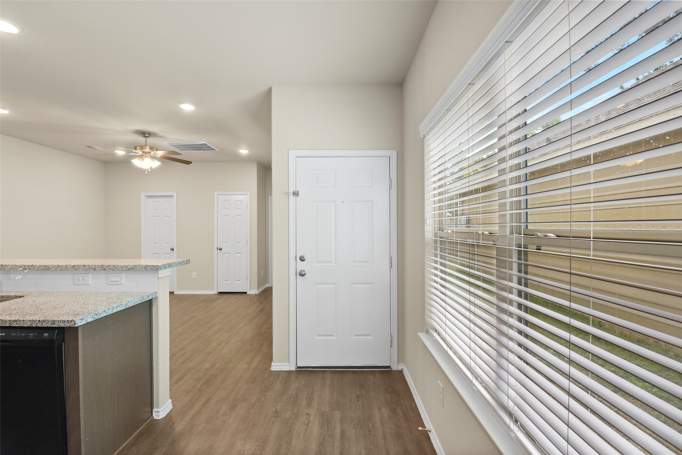 9650 Warm Spring Willis, TX 77318 - Photo 5 of 26 a view of a hallway with wooden floor