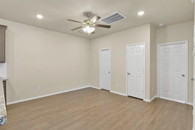 a view of a kitchen with a sink and cabinets