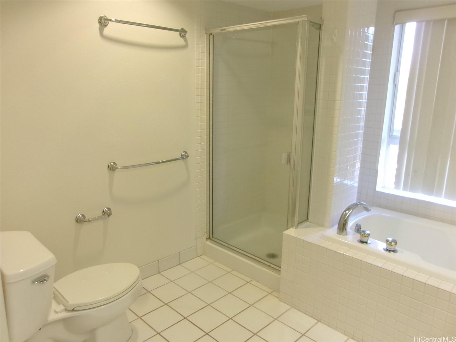1337 Moanalualani Way, Unit 11H Honolulu, HI 96819 - Photo 11 of 19 a bathroom with a sink a toilet and shower