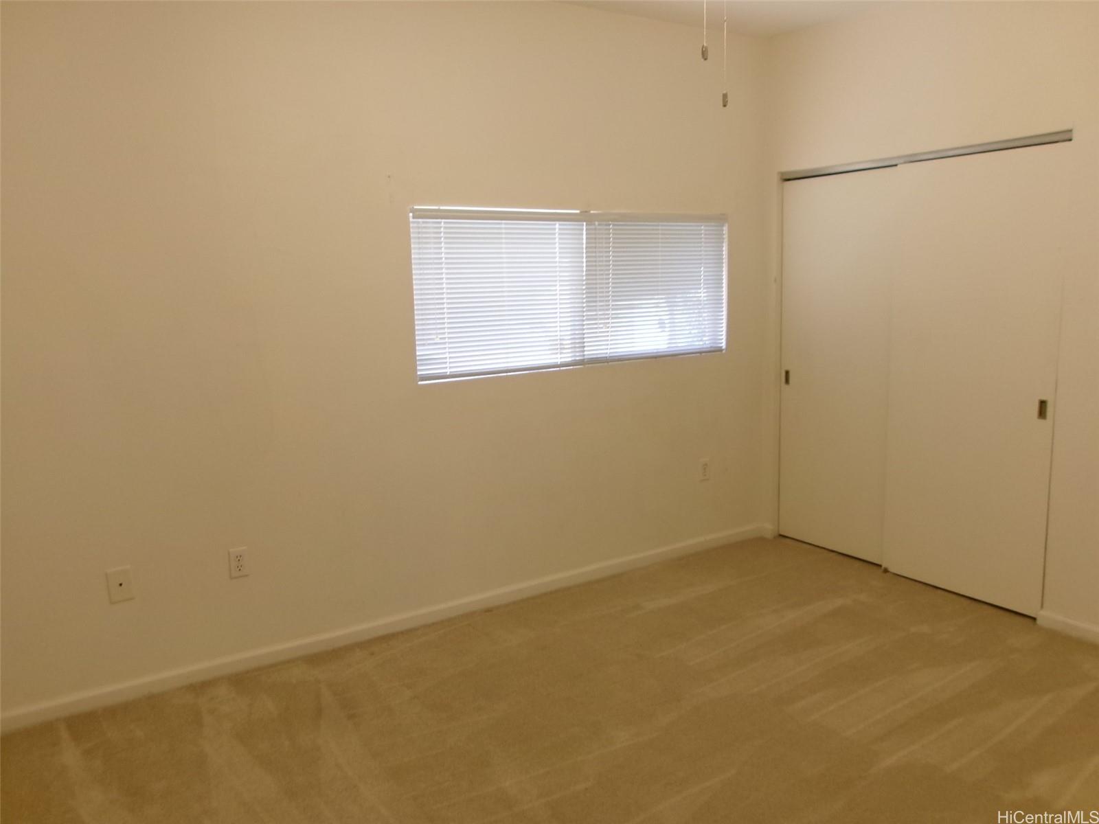 1337 Moanalualani Way, Unit 11H Honolulu, HI 96819 - Photo 14 of 19 an empty room with a window