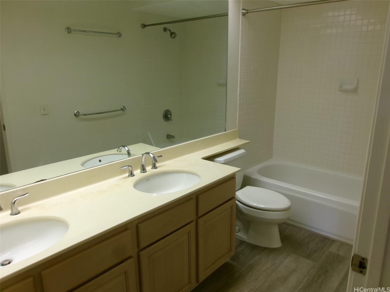 1337 Moanalualani Way, Unit 11H Honolulu, HI 96819 - Photo 15 of 19 a bathroom with a sink and a mirror