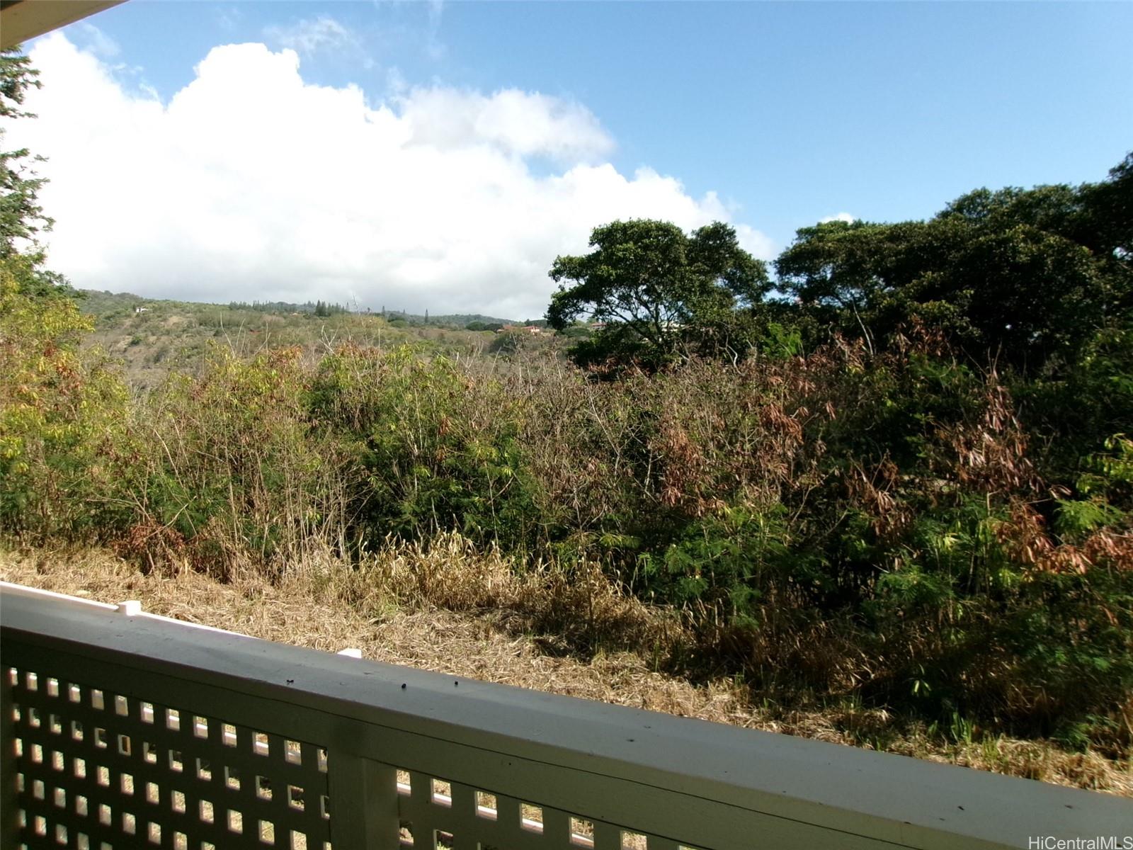 1337 Moanalualani Way, Unit 11H Honolulu, HI 96819 - Photo 17 of 19 a view of a lake from a balcony