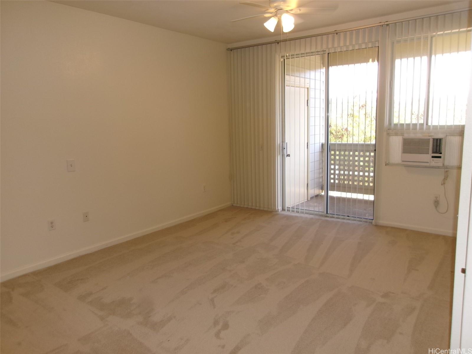 1337 Moanalualani Way, Unit 11H Honolulu, HI 96819 - Photo 8 of 19 a view of an empty room with a window