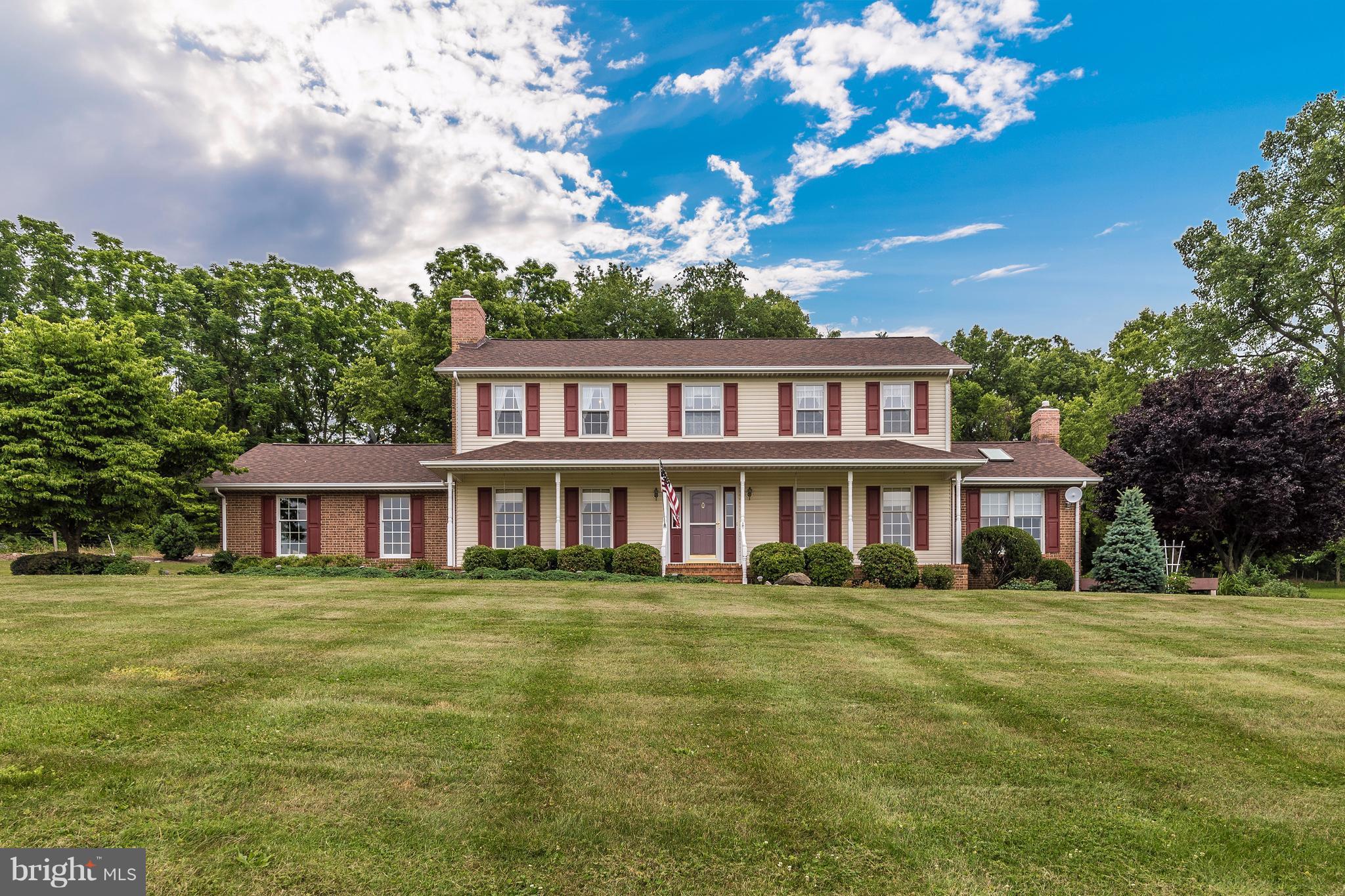 3623 Fry Road Jefferson, MD 21755 - Photo 1 of 30 a view of a house with a big yard and large trees