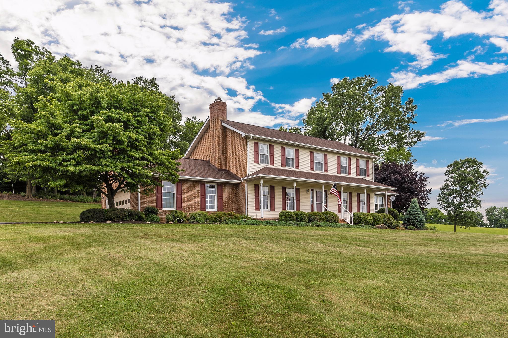 3623 Fry Road Jefferson, MD 21755 - Photo 2 of 30 a front view of a house with a garden