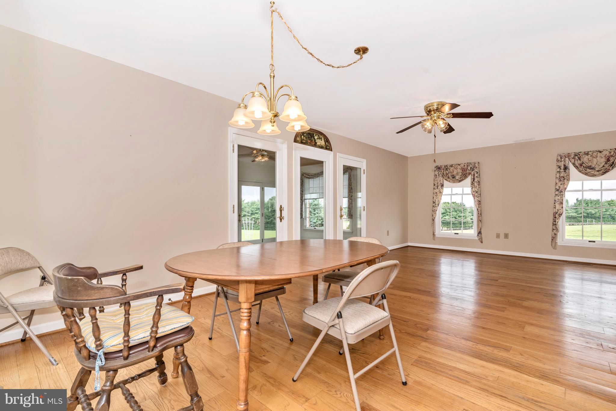 3623 Fry Road Jefferson, MD 21755 - Photo 18 of 30 a view of a dining room with furniture window and wooden floor