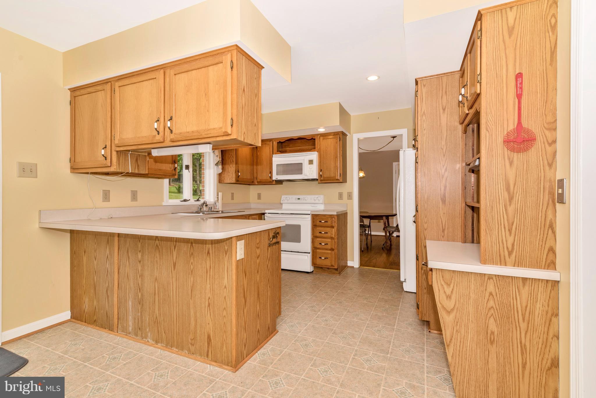 3623 Fry Road Jefferson, MD 21755 - Photo 19 of 30 a kitchen with stainless steel appliances granite countertop a refrigerator and a sink