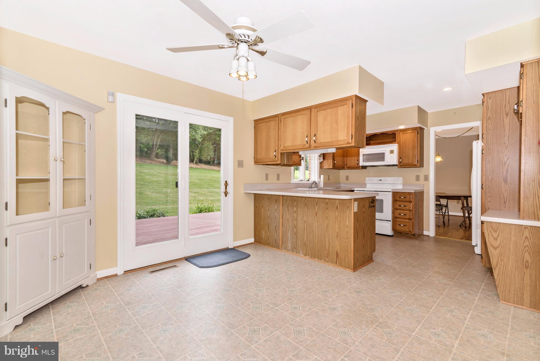 3623 Fry Road Jefferson, MD 21755 - Photo 21 of 30 a view of a kitchen with kitchen island a sink stainless steel appliances and cabinets