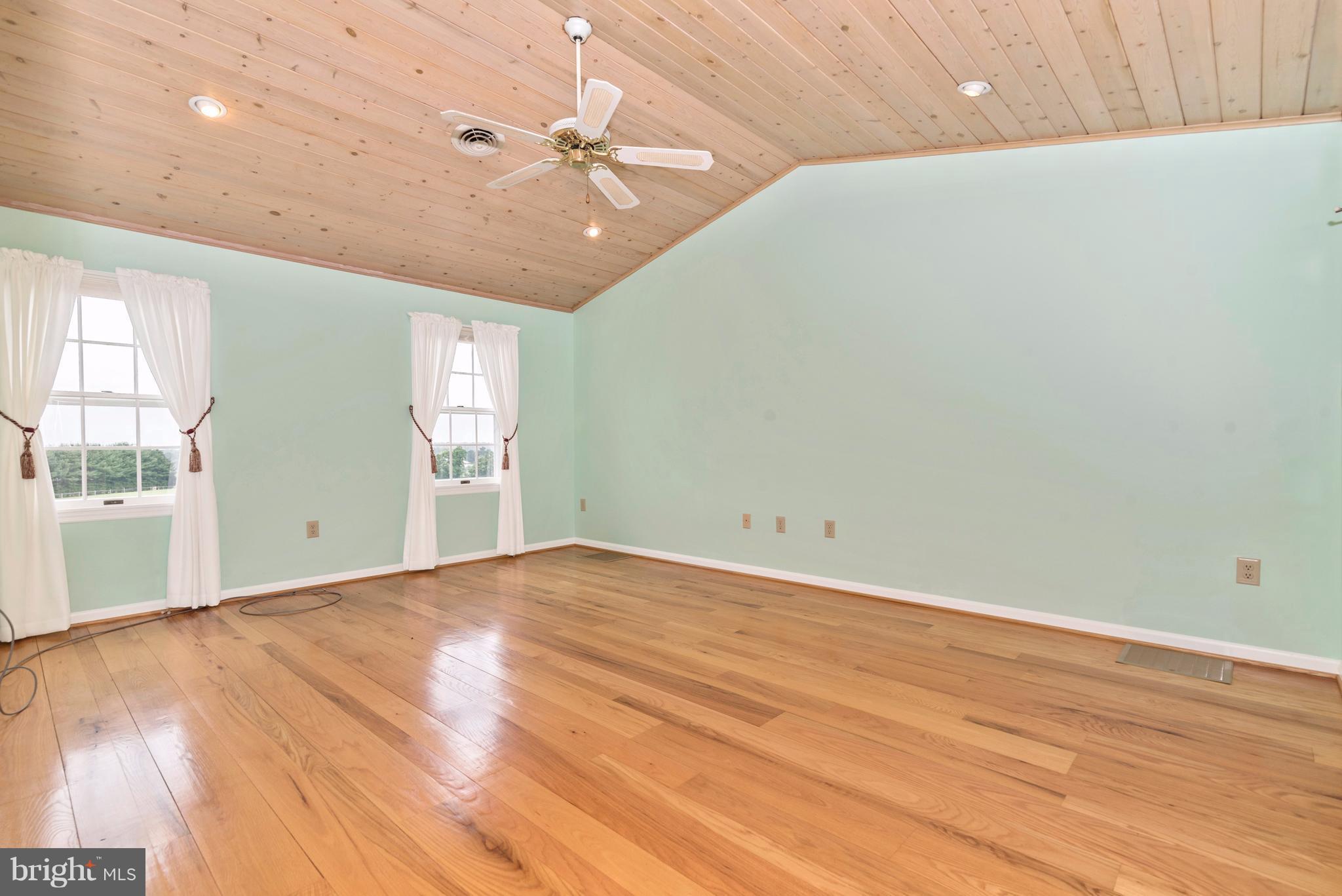 3623 Fry Road Jefferson, MD 21755 - Photo 26 of 30 an empty room with wooden floor and windows