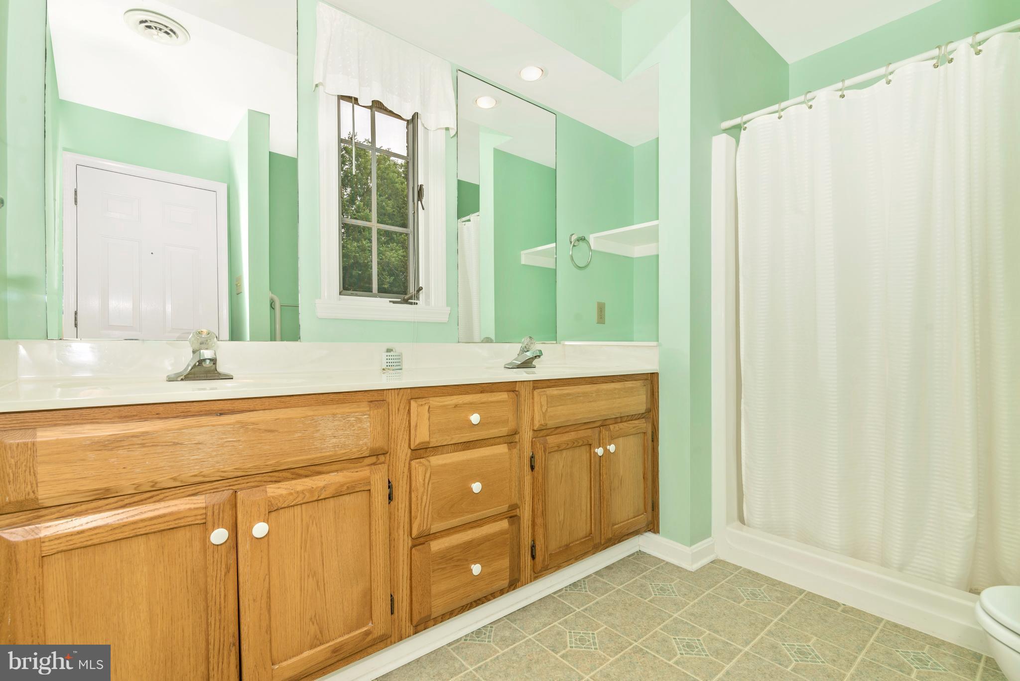3623 Fry Road Jefferson, MD 21755 - Photo 28 of 30 a bathroom with a double vanity sink and mirror