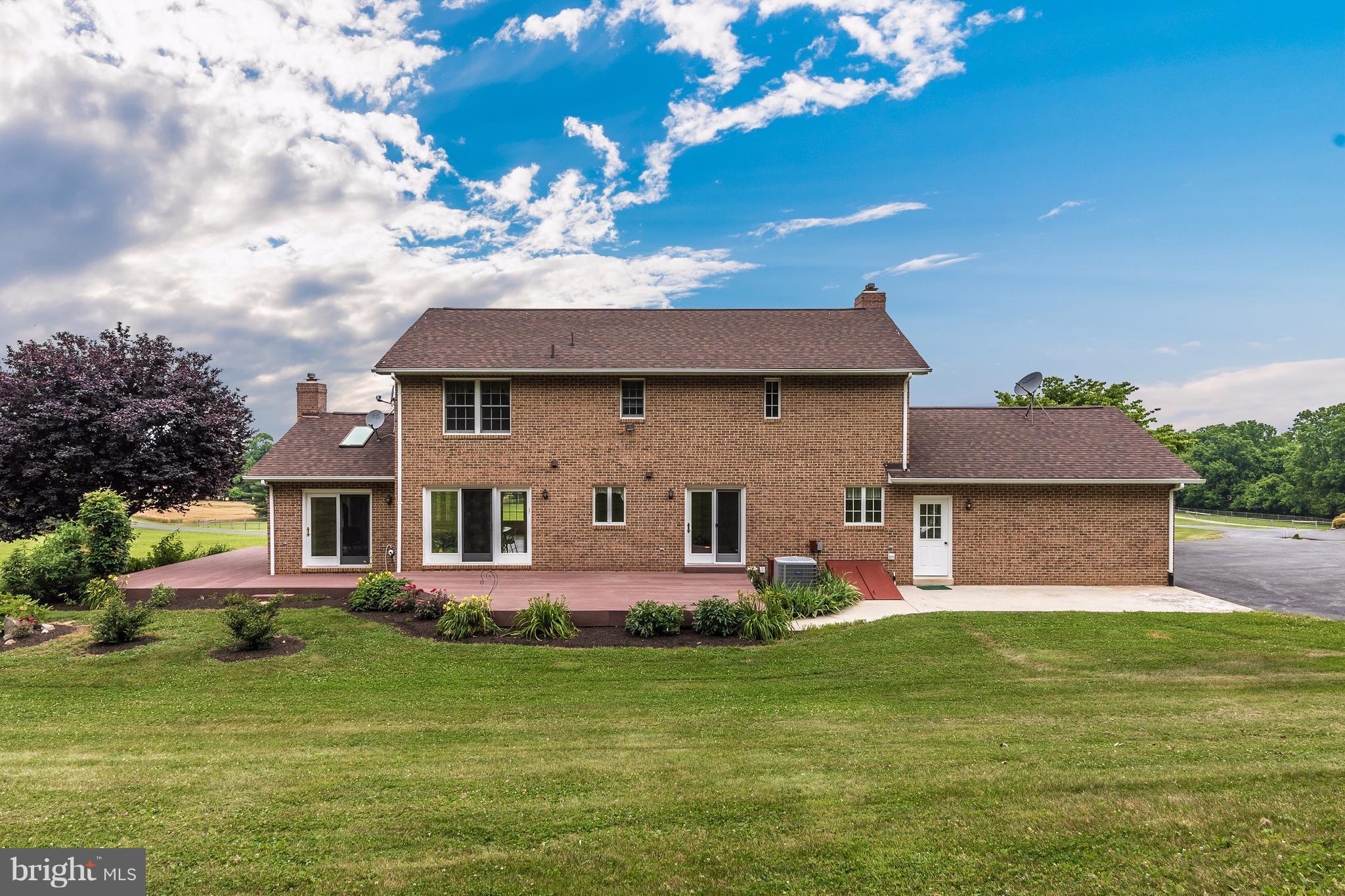 3623 Fry Road Jefferson, MD 21755 - Photo 7 of 30 a front view of a house with a garden and plants