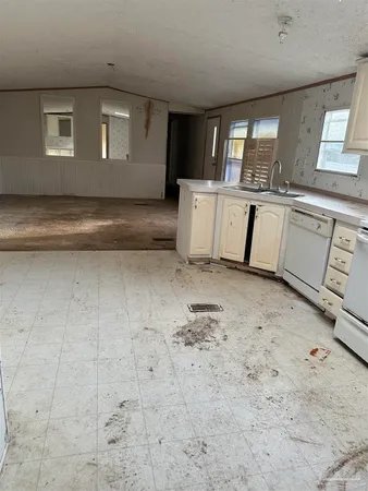 a view of a kitchen with a sink