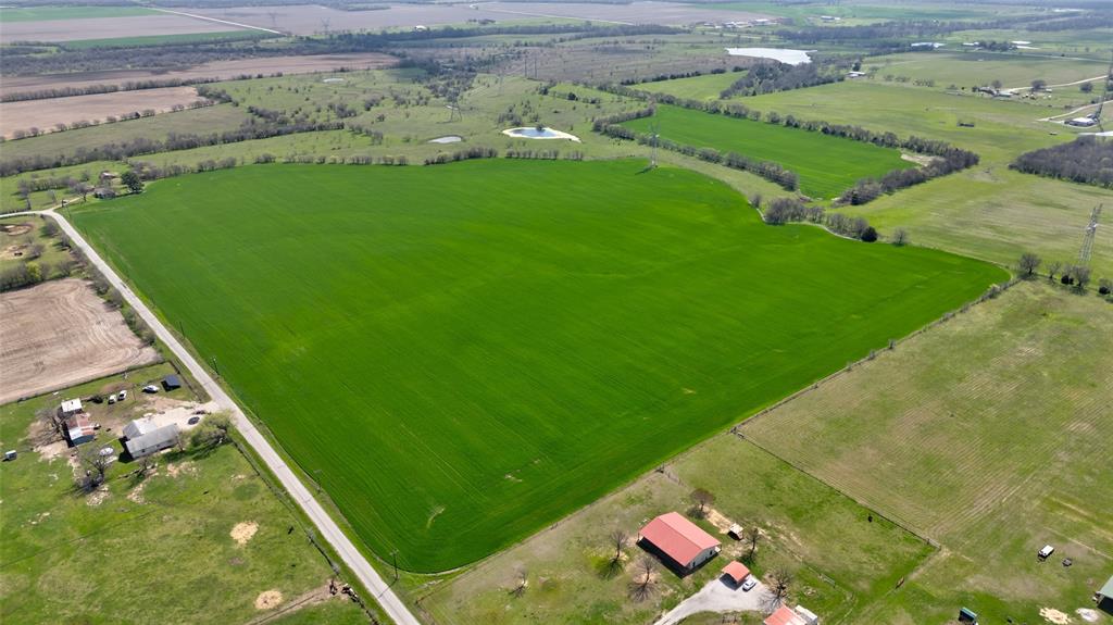 1086 Cobler Road Collinsville, TX 76233 - Photo 17 of 40 a view of a lake with a big yard