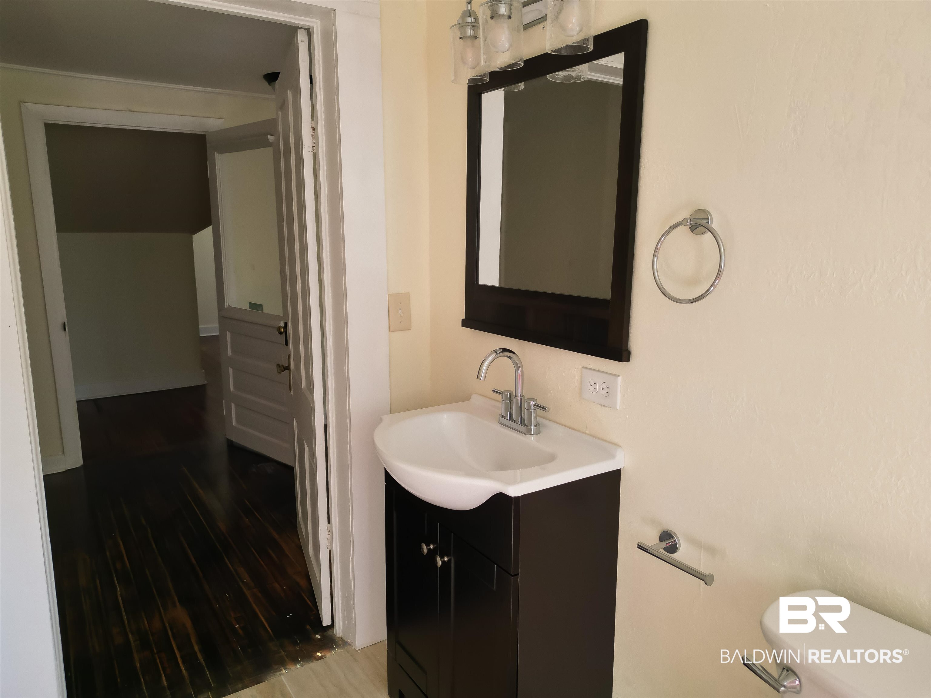 73 Liberty Street Monroeville, AL 36460 - Photo 22 of 29 Bathroom with vanity, toilet, and wood-type flooring