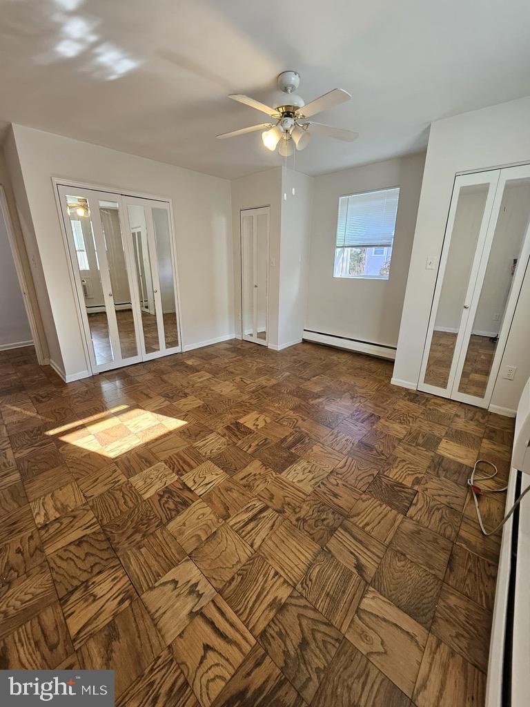 412 North Wayne Avenue, Unit 203 Wayne, PA 19087 - Photo 17 of 21 a view of an empty room with windows