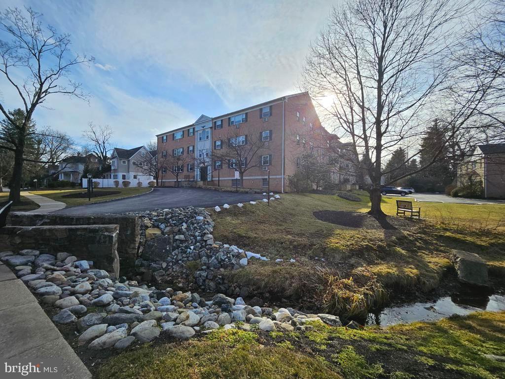 412 North Wayne Avenue, Unit 203 Wayne, PA 19087 - Photo 2 of 21 a city view with tall trees