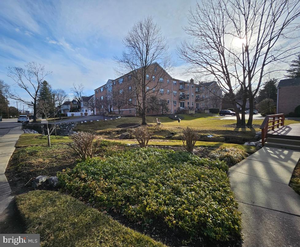 412 North Wayne Avenue, Unit 203 Wayne, PA 19087 - Photo 21 of 21 a view of a yard with a house