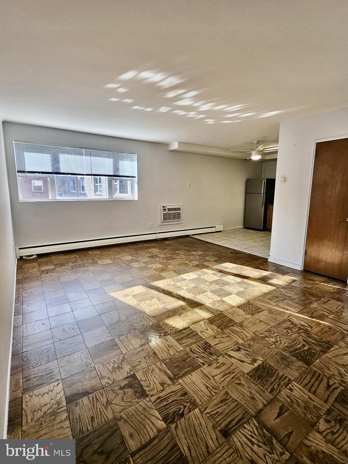 412 North Wayne Avenue, Unit 203 Wayne, PA 19087 - Photo 8 of 21 a view of a livingroom with kitchen and furniture