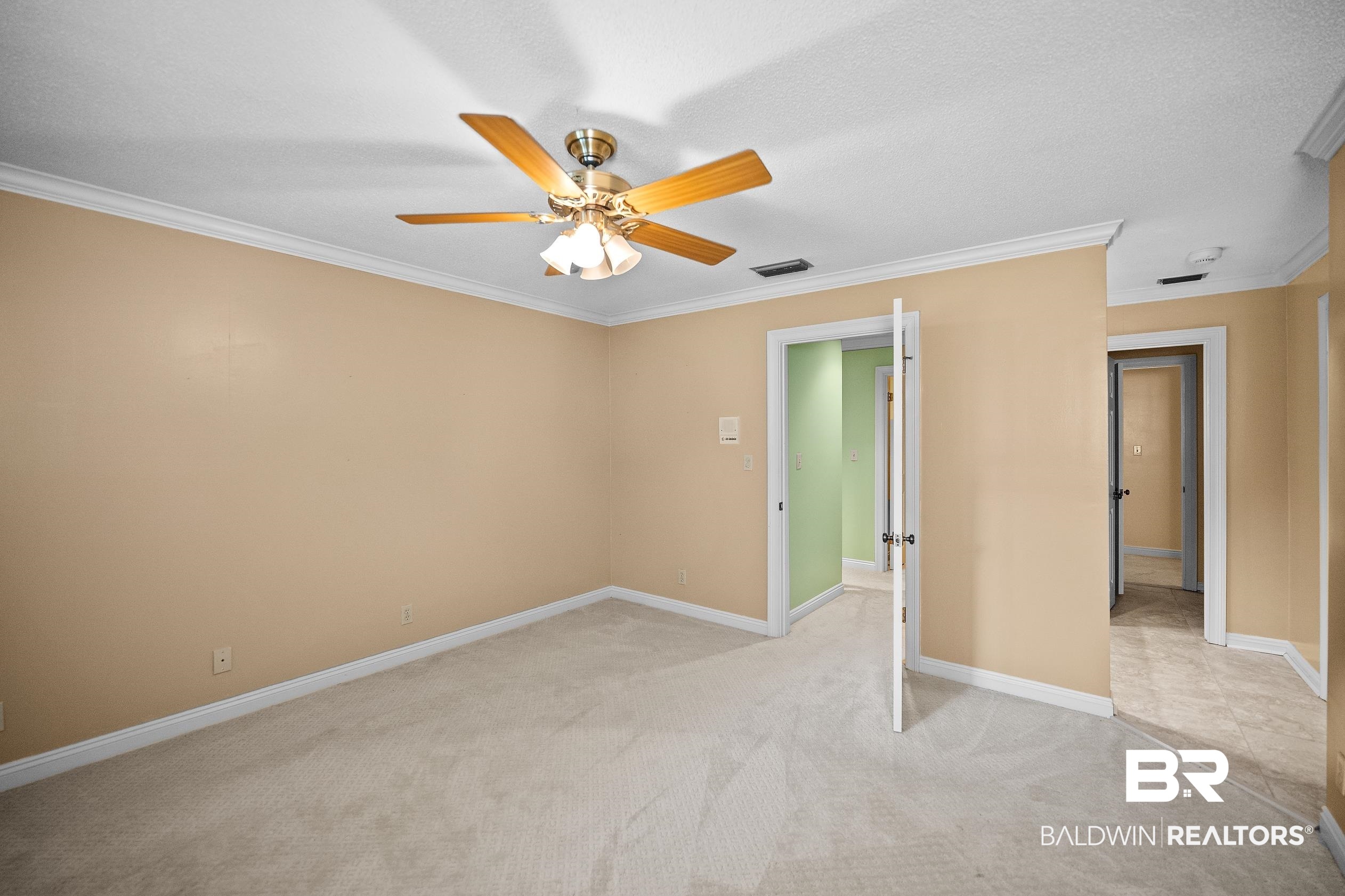 329 Norwood Road Monroeville, AL 36460 - Photo 28 of 49 Neutral tone walls with crown molding and white baseboards