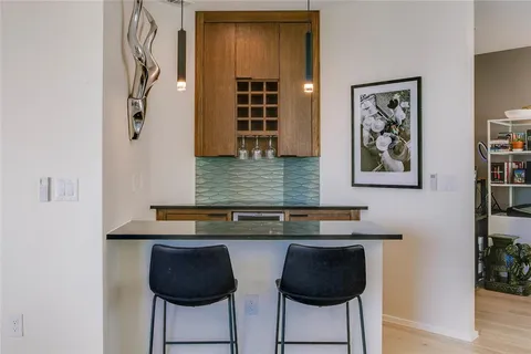 a view of a workspace room with furniture and wooden floor