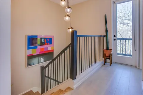 a view of a hallway with windows