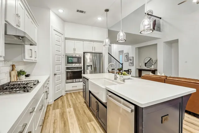 a very nice looking dining room with a large window