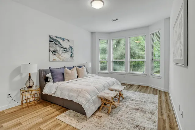a kitchen with a sink and a large window
