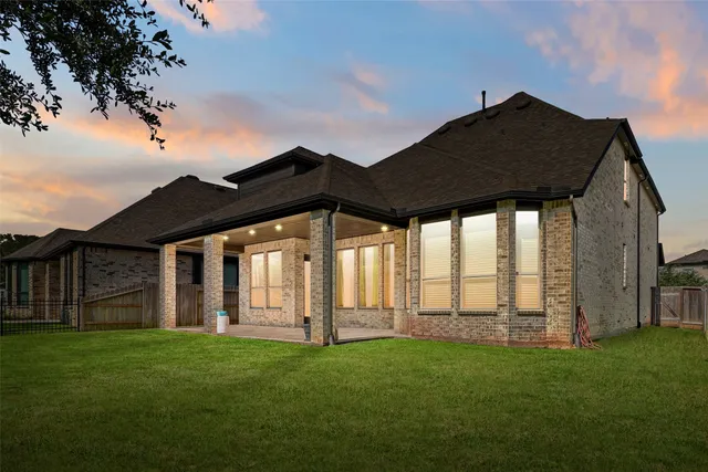 a view of a house with yard porch and furniture