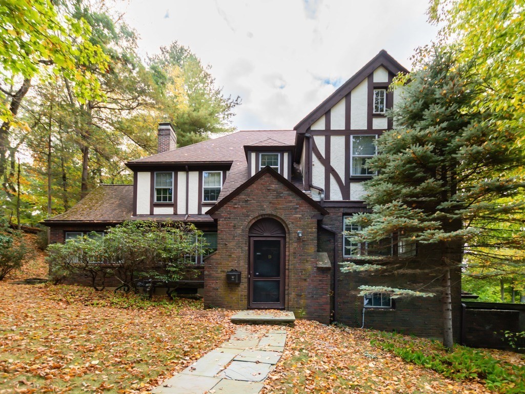 9 Sylvan Road Wellesley, MA 02481 - Photo 1 of 8 a front view of a house with a yard