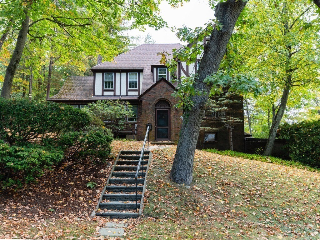 9 Sylvan Road Wellesley, MA 02481 - Photo 3 of 8 a front view of a house with garden