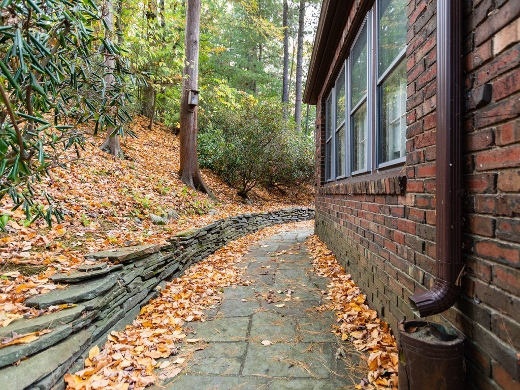 9 Sylvan Road Wellesley, MA 02481 - Photo 6 of 8 a view of a pathway both side of the house