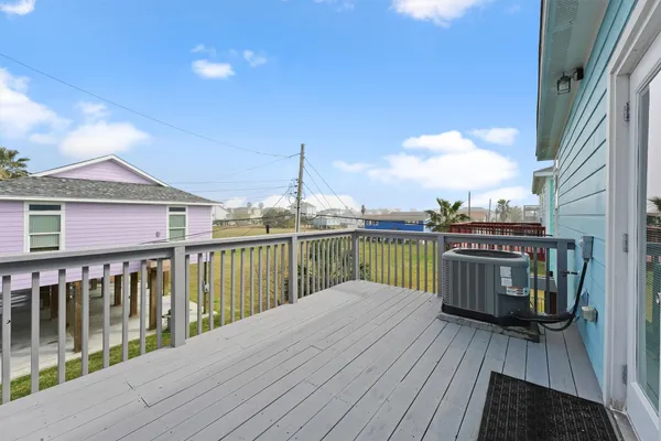 a view of a balcony with wooden floor