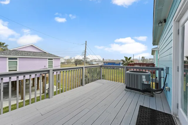 a view of a balcony with wooden floor