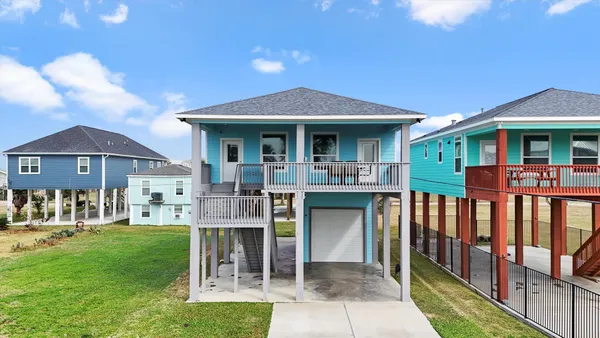 a front view of a house with a yard table and chairs