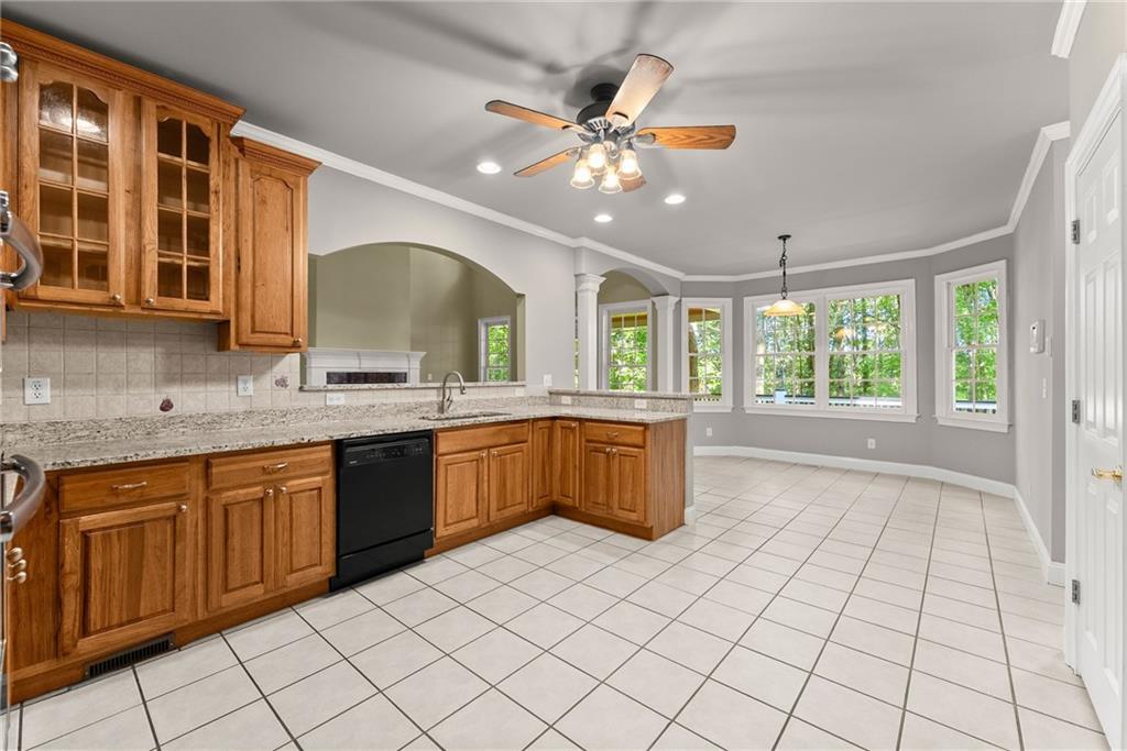 1040 Auburn Road Dacula, GA 30019 - Photo 12 of 42 a large kitchen with a large window cabinets and stainless steel appliances