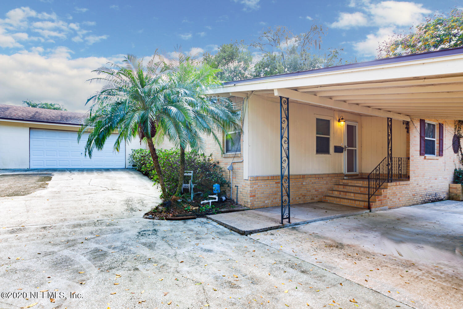 4009 Bess Road Jacksonville, FL 32277 - Photo 2 of 21 front from north with garage
