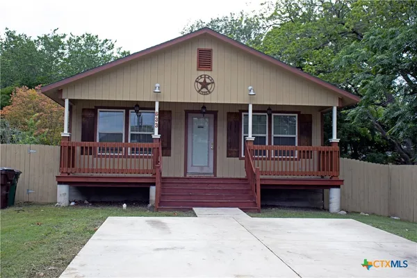 a front view of a house with a deck